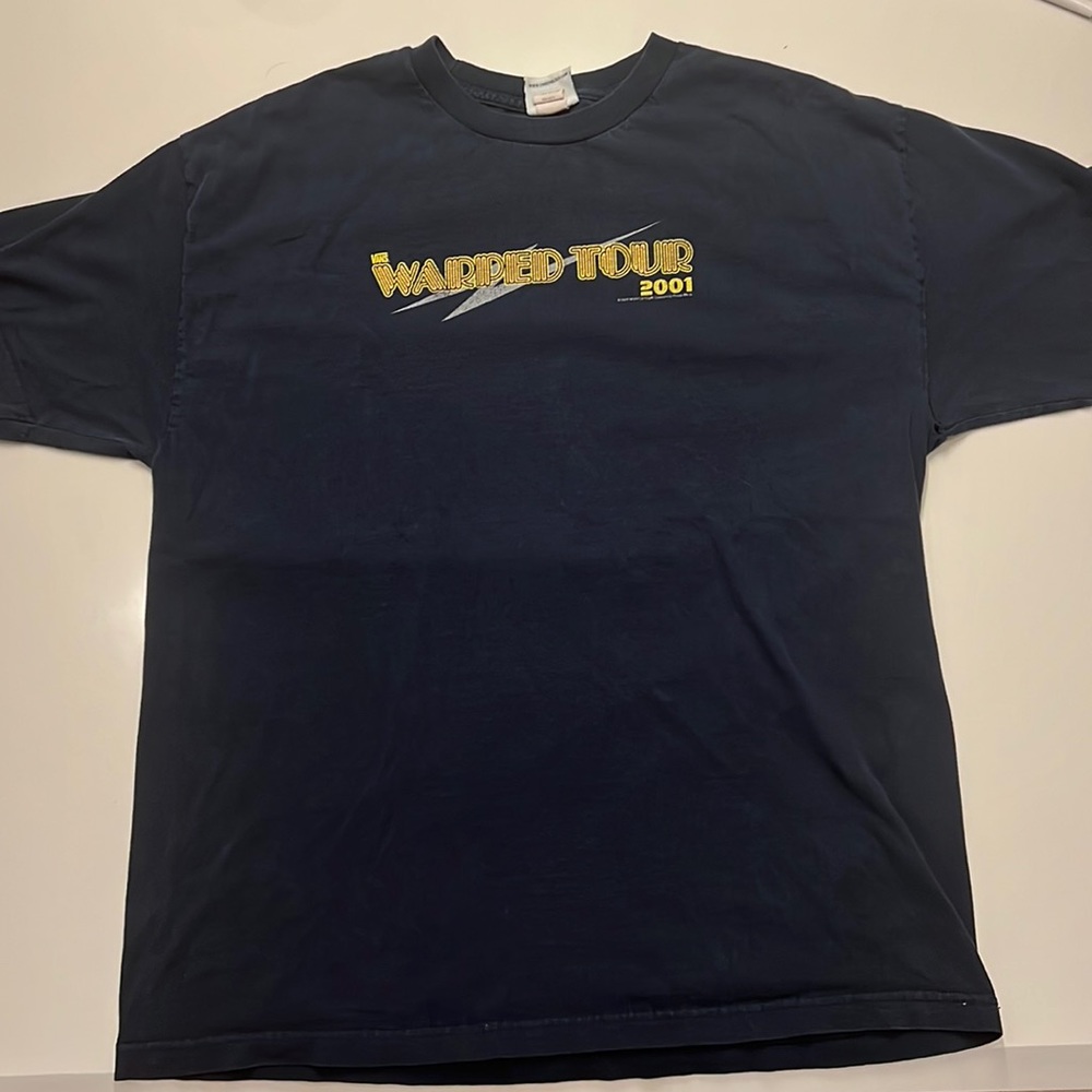 This is a unique T-shirt from 2001 and was made during the 2001 Warped Tour!